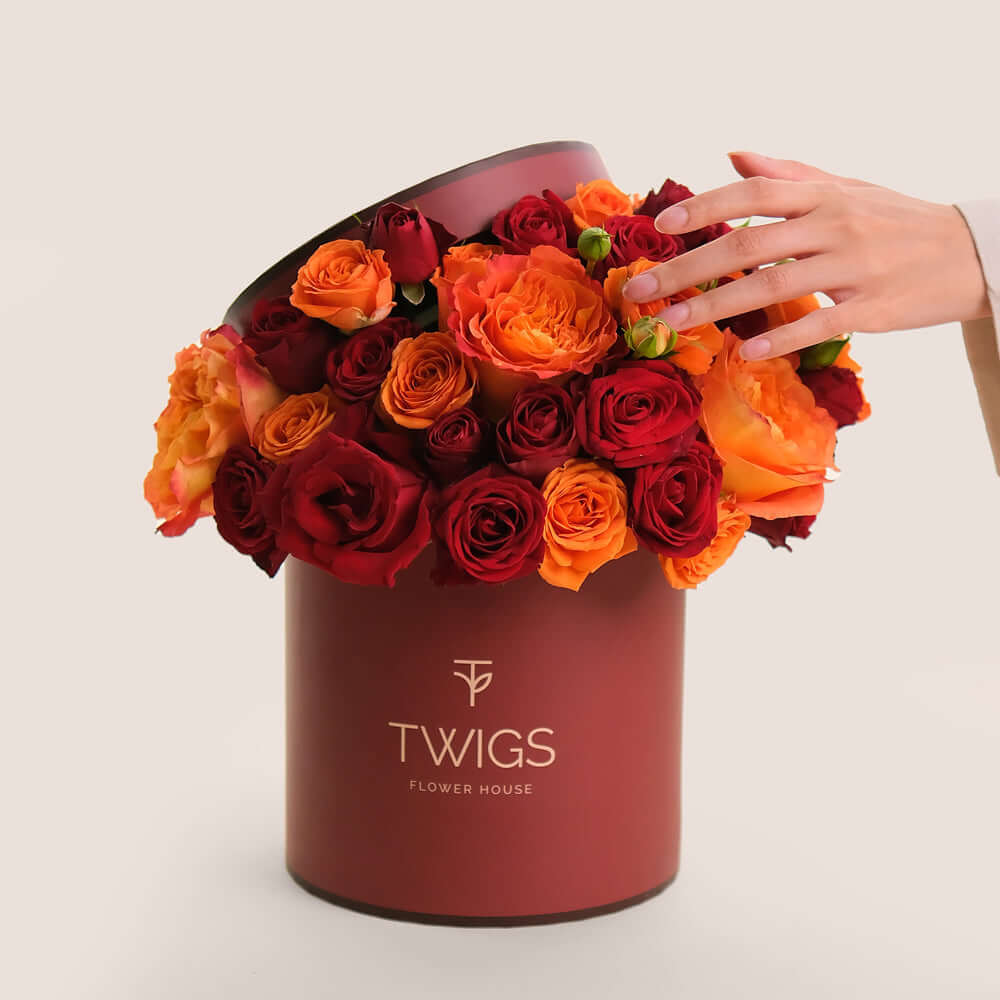 Luxury rose gift box in Dubai with premium orange and red roses by TWIGS Flower House