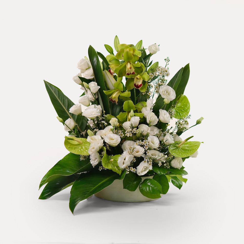 special orchids with lily and lisianthus flower arrangement in white ceramic vase