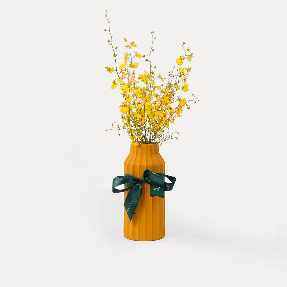 Dancing Lady Flowers in Tall Yellow Vase Arrangement