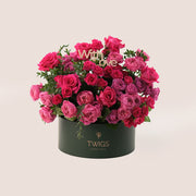 Hot pink roses round box arrangement from above showing full bloom display - TWIGS flower box