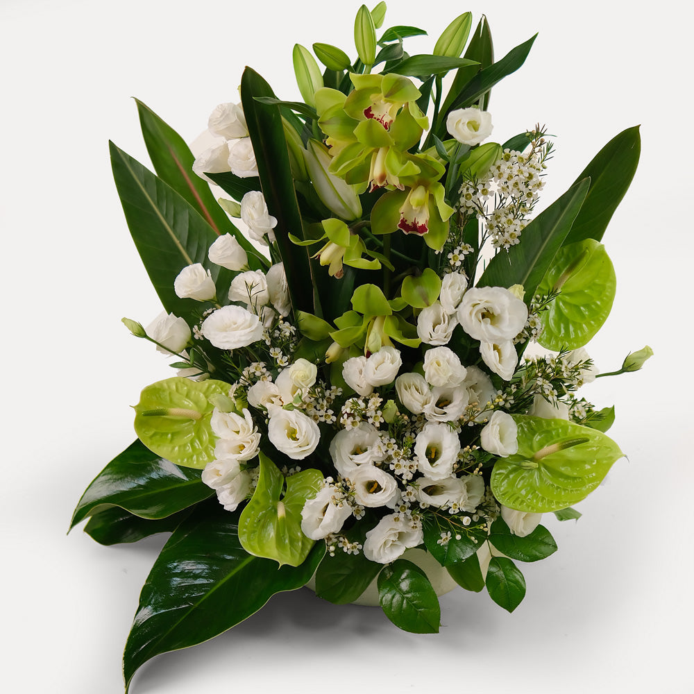 special orchids with lily and lisianthus flower arrangement in white ceramic vase