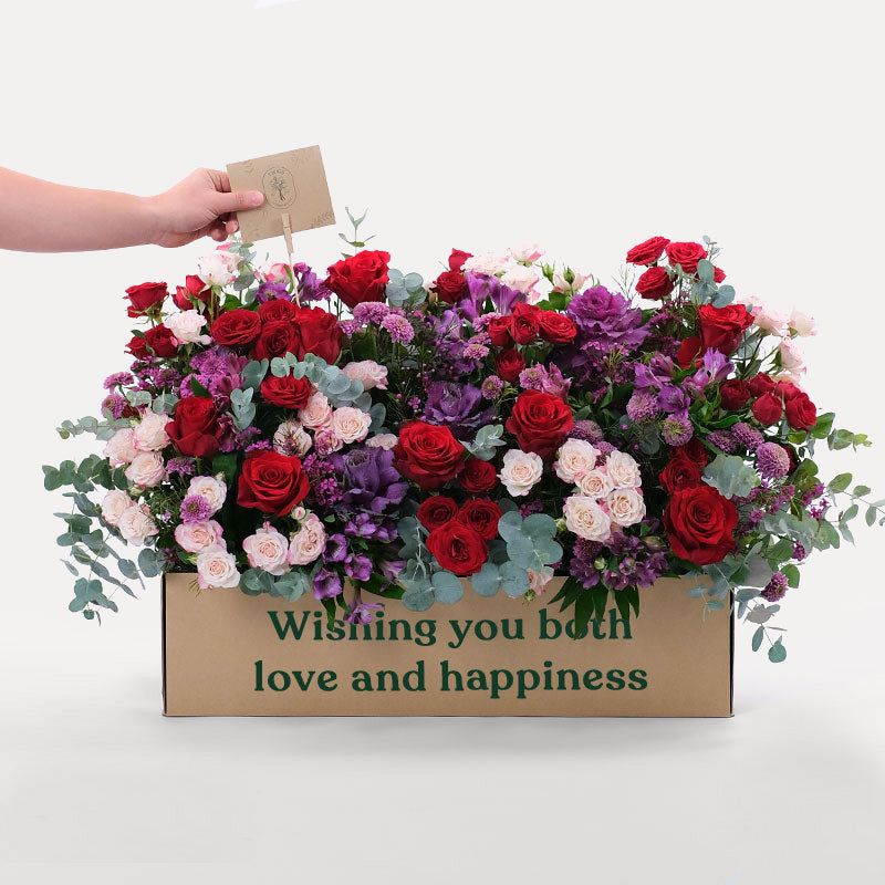   Fresh Flowers elegantly nestled in our celebrated Garden Box. Each petal exudes vibrancy, harmonizing with the natural charm of the arrangement. An ideal gift to honor special moments and adorn spaces with botanical elegance. Transform your surroundings with the beauty of our handcrafted blooms.  
