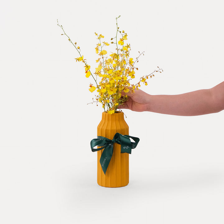 Dancing Lady Flowers in Tall Yellow Vase Arrangement
