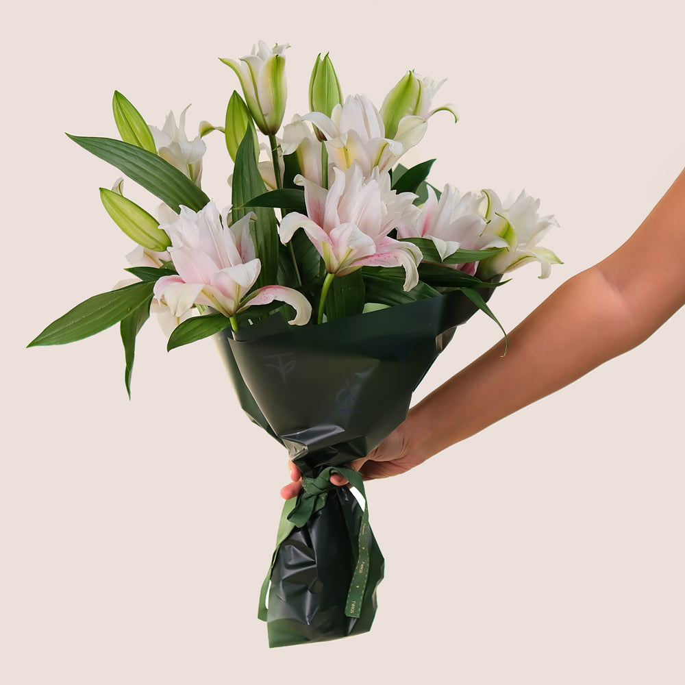 Double Petalled Lilies in TWIGS Cone-Shaped Carry Bag– Elegance in Every Petal