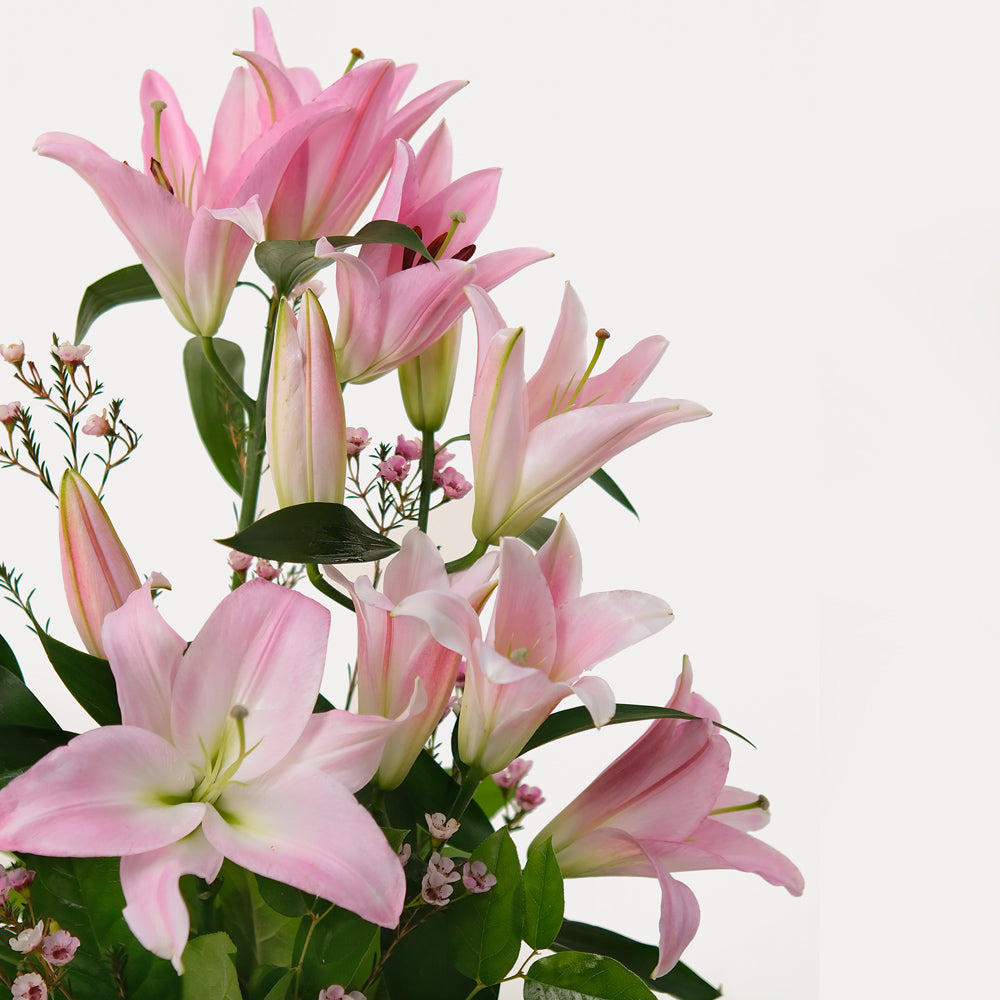 Pink lily Flower arrangement in ceramic vase