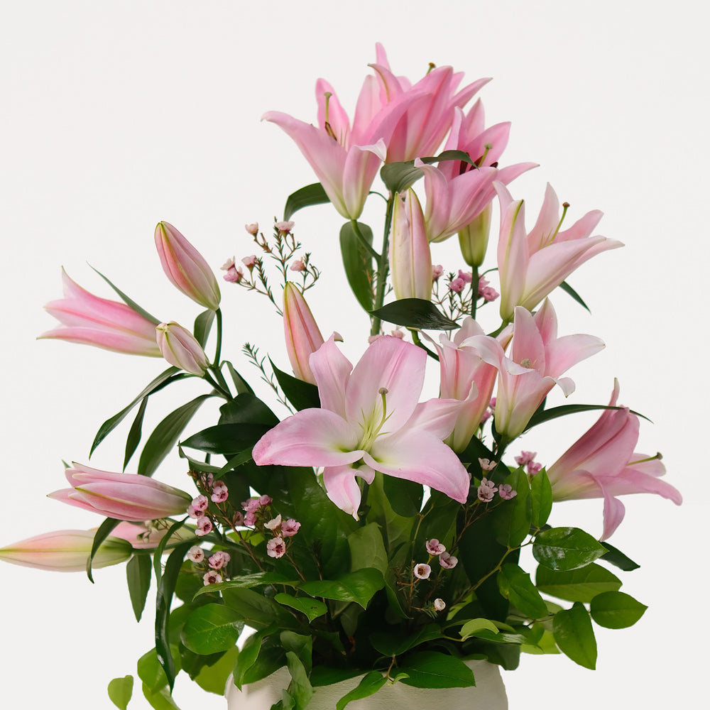 Pink lily Flower arrangement in ceramic vase