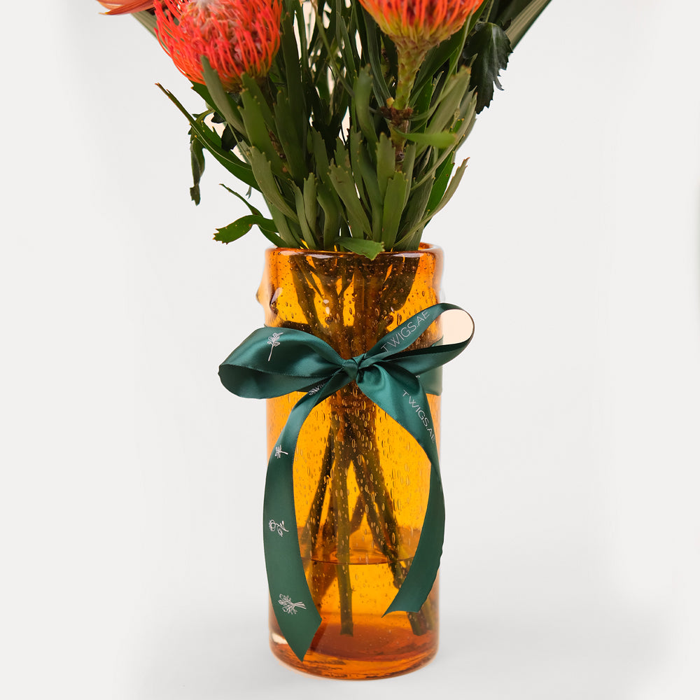 TROPICAL LEUCOSPERMUM ORANGE FLOWER VASE ARRANGEMENT