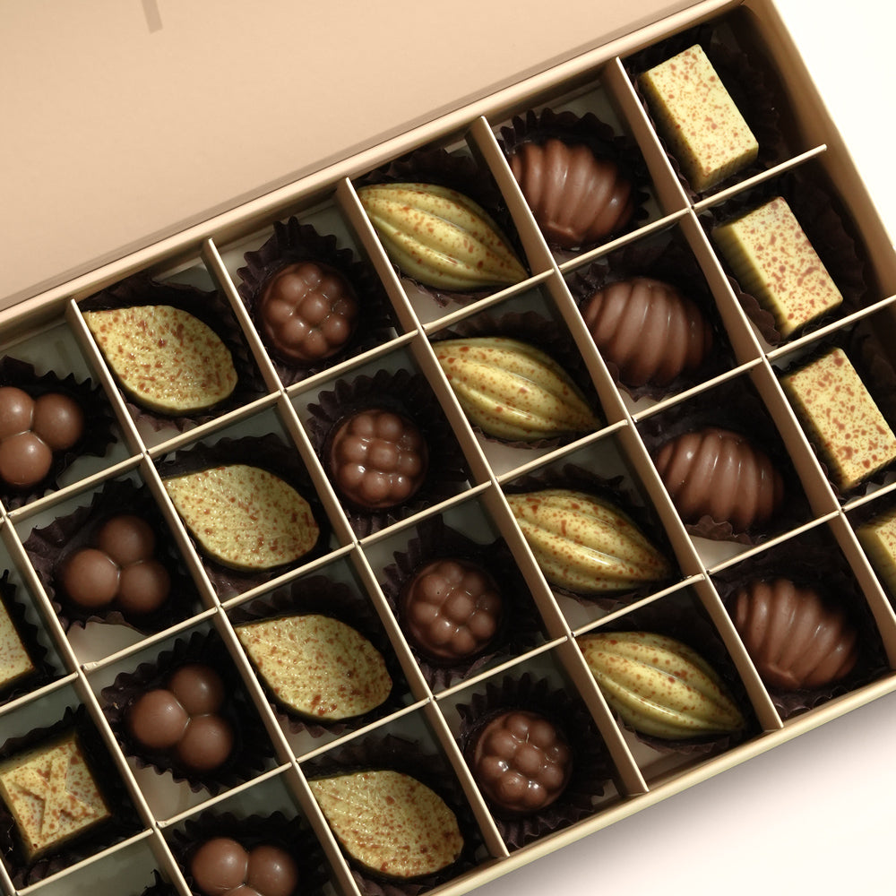 TWIGS signature cream box open showing 32 assorted handcrafted chocolates, Father's Day gift Dubai