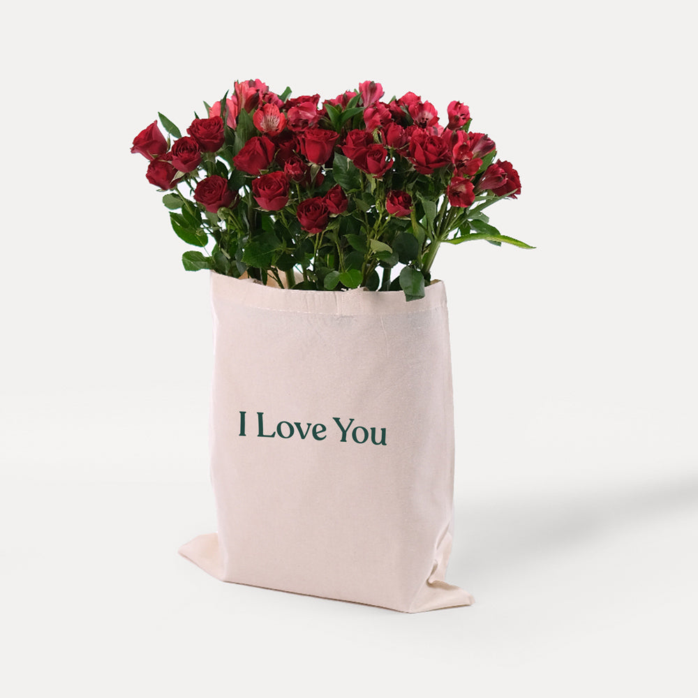 Red Spray Roses & Red Alstroemerias in a Reusable Canvas Tote – A Passionate Blend for Memorable Moments