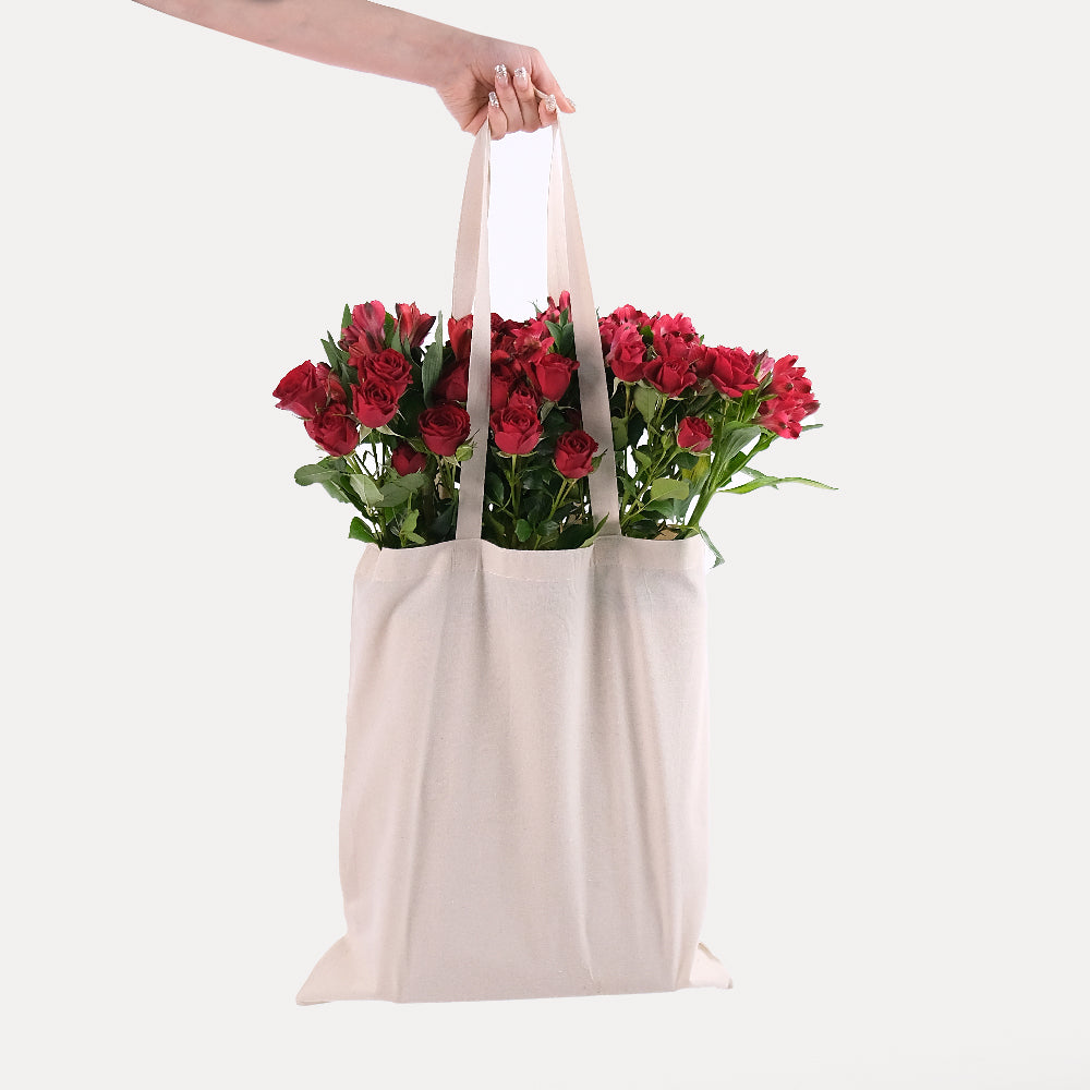 Red Spray Roses & Red Alstroemerias in a Reusable Canvas Tote – A Passionate Blend for Memorable Moments