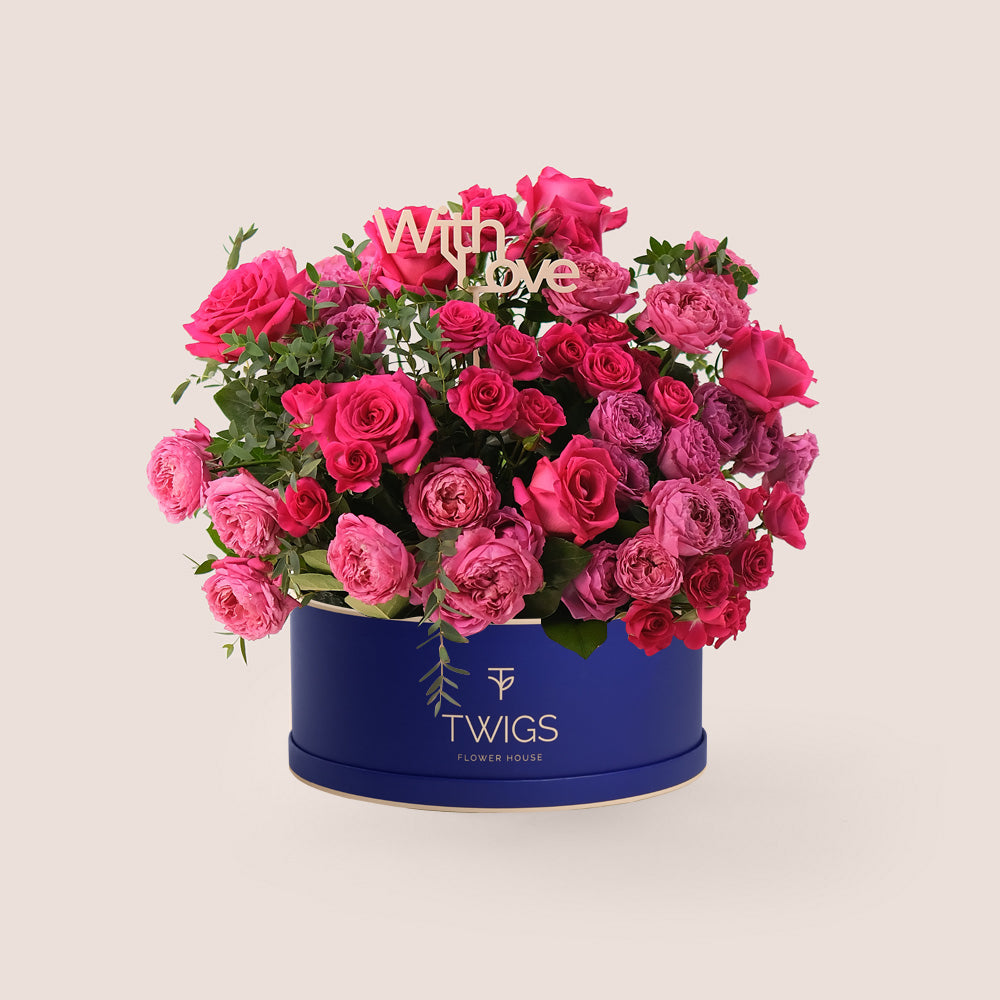A mix of Juliet cerise roses, Pink Floyd garden roses, and spray roses in hot pink shades