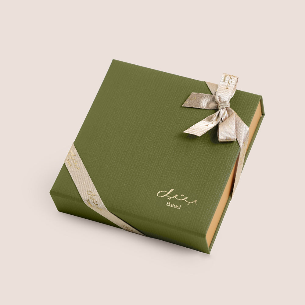 
Bateel Palm Gift Set with date chocolates in a green silk-textured gold base box, luxury flower add-on gift Dubai UAE