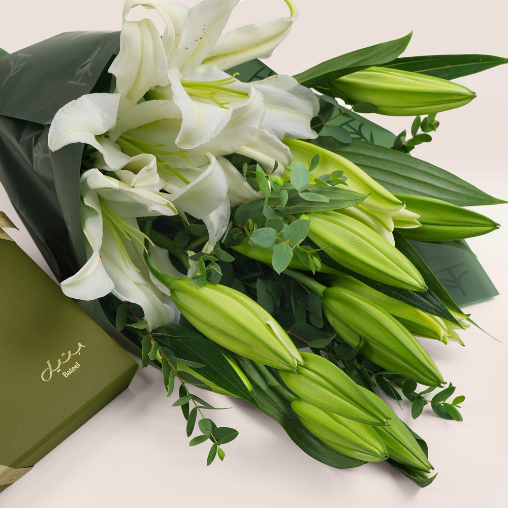 Bateel stuffed dates with fresh lilly flower bunch dubai UAE