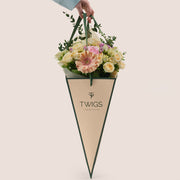 Peach Harmony Mother’s Day flower arrangement with peach roses in TWIGS cone shaped flower carry bag