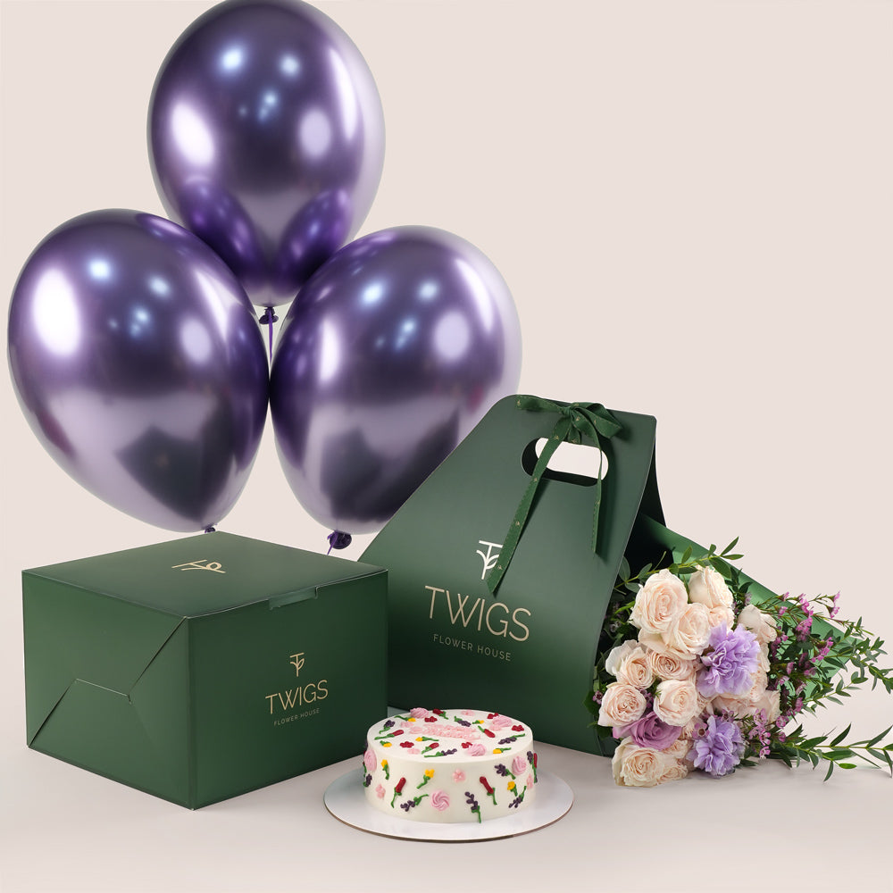 Birthday cake and bouquet of flowers with purple balloons