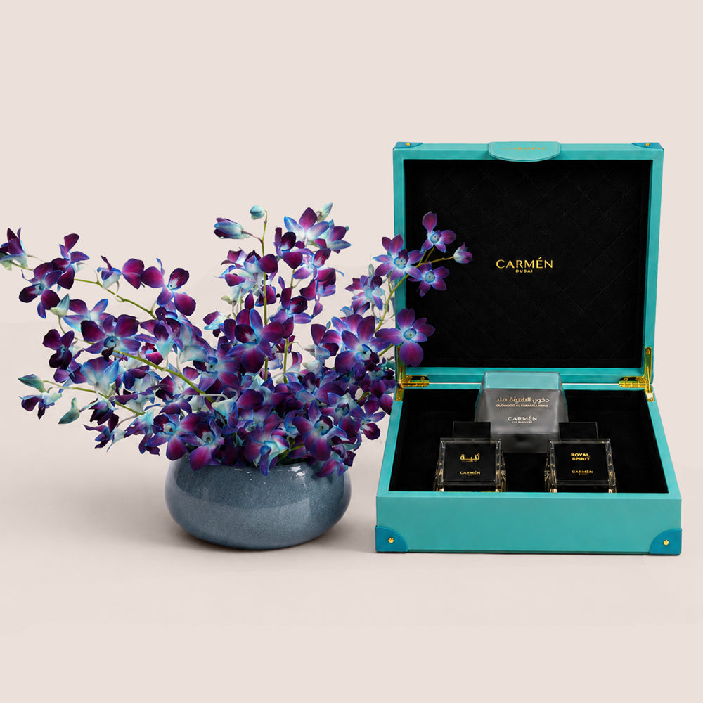 Blue dendrobium orchid vase with Carmen Gift Box Season perfume set