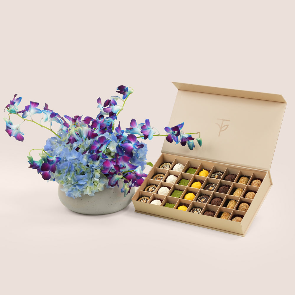 Blue dendrobium orchid and hydrangea in TWIGS grey ceramic vase with 32-piece truffle box — Eid Al Adha luxury gift set Dubai