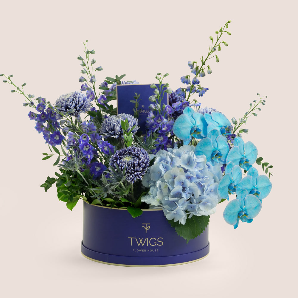 Blue Hour Grande — blue delphiniums, chrysanthemums, hydrangeas and phalaenopsis orchids in a TWIGS navy round box, Father's Day flower arrangement Dubai