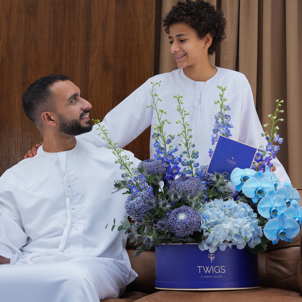 Blue Hour Grande — blue delphiniums, chrysanthemums, hydrangeas and phalaenopsis orchids in a TWIGS navy round box, Father's Day flower arrangement Dubai