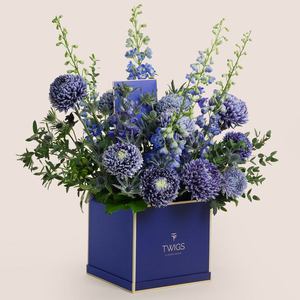 Blue floral arrangement in blue 'TWIGS' flower box