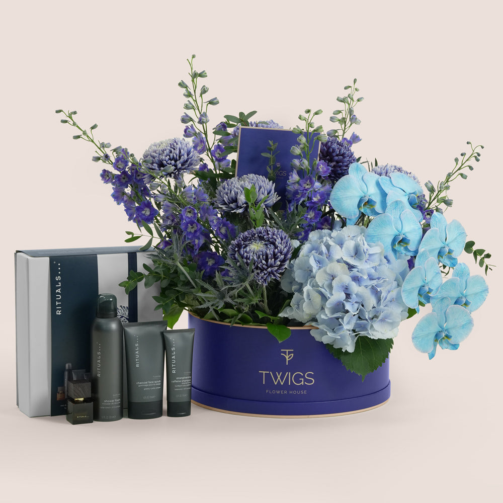Blue Hour Ritual — blue delphiniums, chrysanthemums, hydrangeas and phalaenopsis orchids in a TWIGS navy round box alongside Rituals Homme Gift Set, Father's Day Dubai