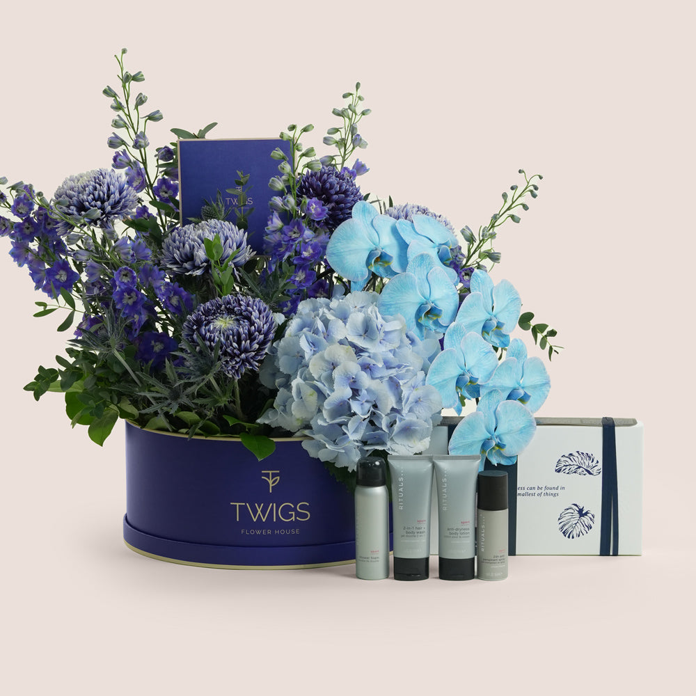 Blue Hour Ritual — blue delphiniums, chrysanthemums, hydrangeas and phalaenopsis orchids in a TWIGS navy round box alongside Rituals Homme Gift Set, Father's Day Dubai
