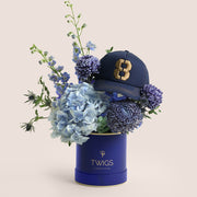 Blue Dusk & Code Eight — blue hydrangeas, delphiniums and chrysanthemums in a TWIGS navy round box with Code 8 baseball cap, Father's Day gift set Dubai