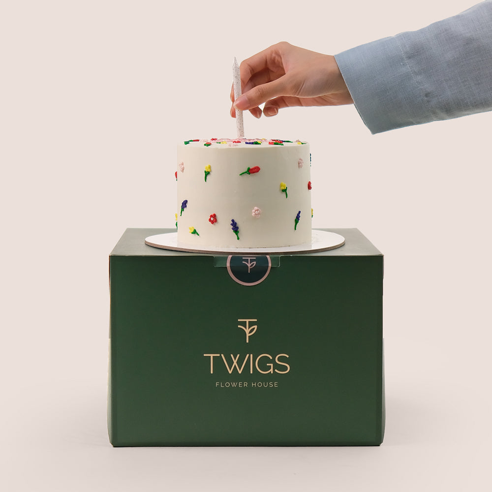  Flowers and small cake, and purple balloons TWIGS UAE