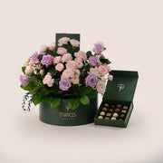 Close-up of lavender and pink roses arrangement in TWIGS flower box - elegant romantic gift UAE