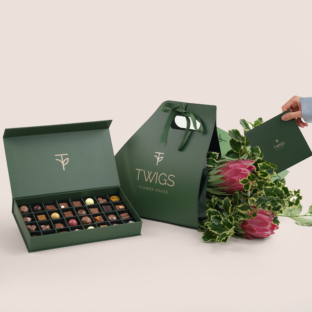 TWIGS Green gift box with chocolates and a flower arrangement 