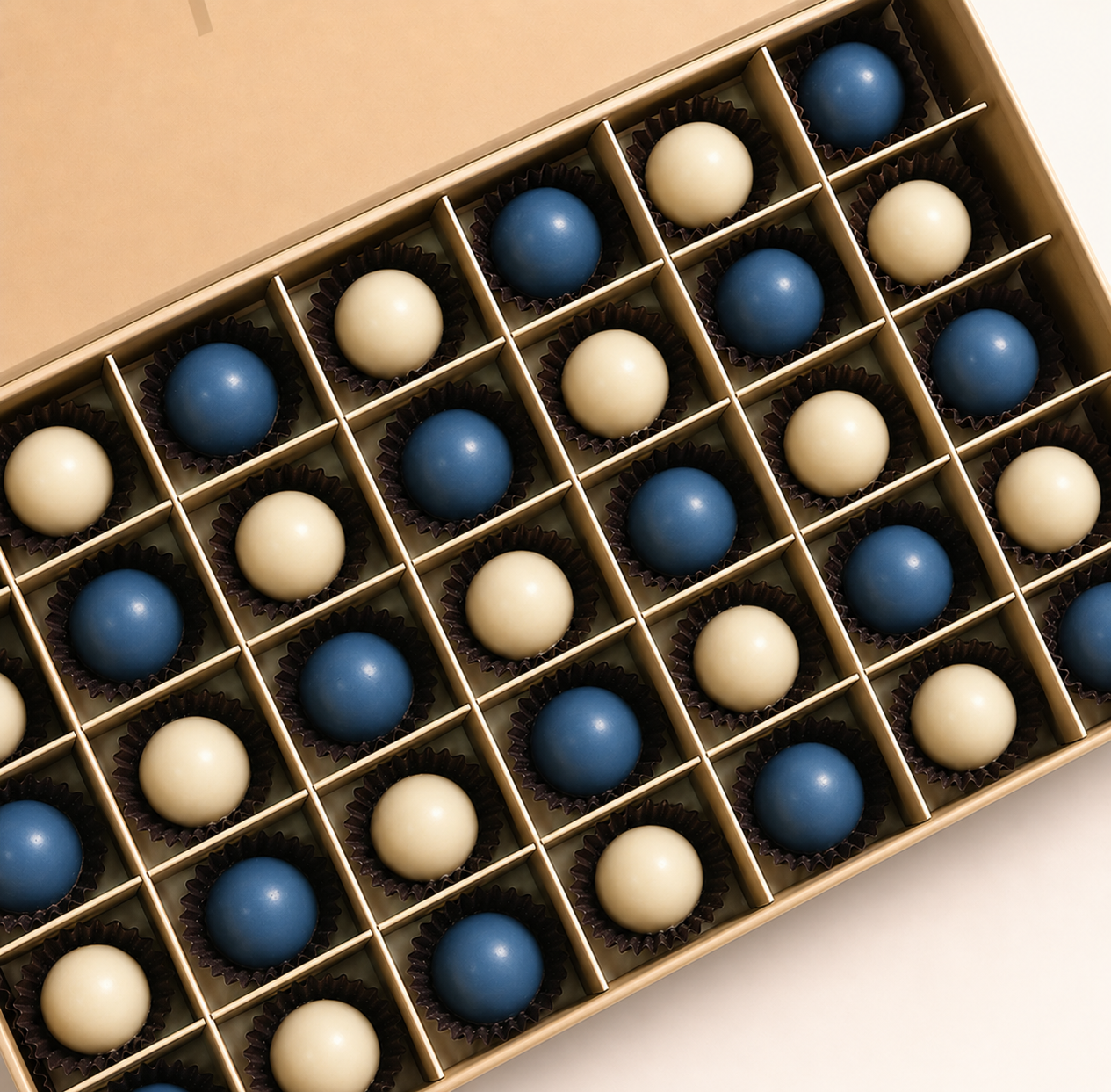 Midnight Bonbons — 32 handcrafted navy and ivory chocolate bonbons in TWIGS signature cream box, gift add-on Dubai
