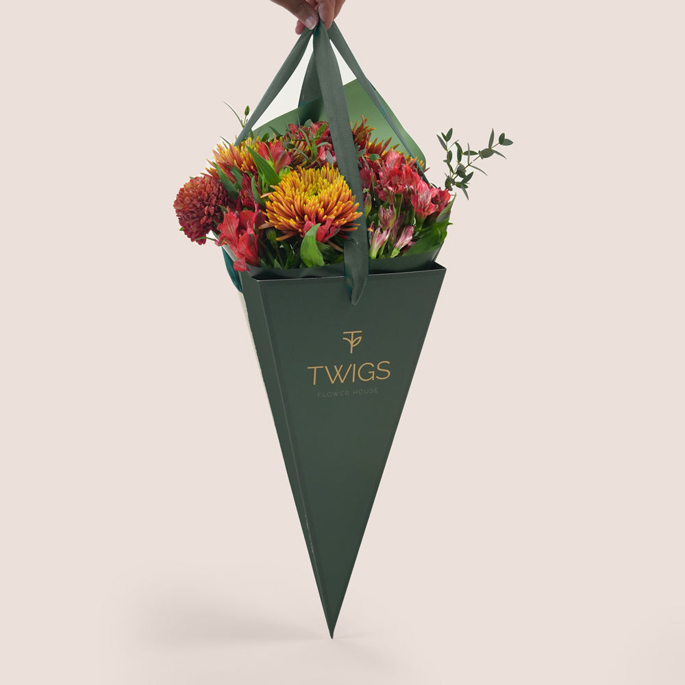 Ruby Eid flower bouquet with saffina chrysanthemums in TWIGS cone carry flower bag Dubai