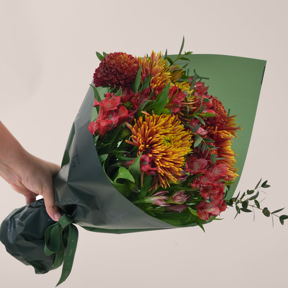 Ruby Eid flower bouquet with saffina chrysanthemums in TWIGS cone carry flower bag Dubai