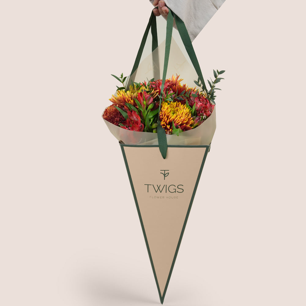 Ruby Eid flower bouquet with saffina chrysanthemums in TWIGS cone carry flower bag Dubai