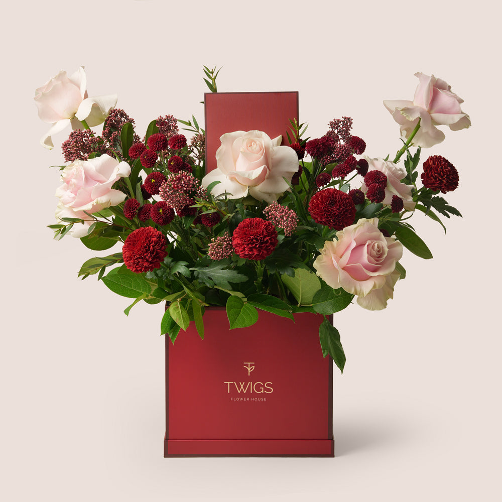 Luxury Eid flower box with Mondial roses, burgundy mums and skimmia in TWIGS square box – UAE delivery