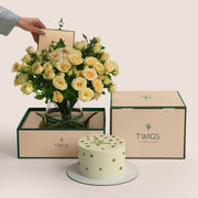 Eid flower vase arrangement with creamy roses in TWIGS carry box paired with celebration cake gift set Dubai