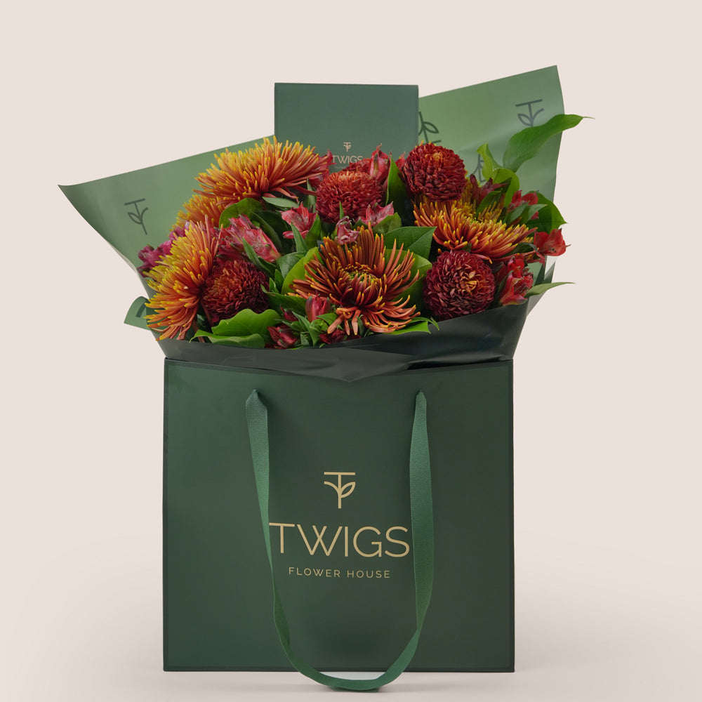 Ruby Eid flower bouquet with saffina chrysanthemums in TWIGS signature gift bag Dubai