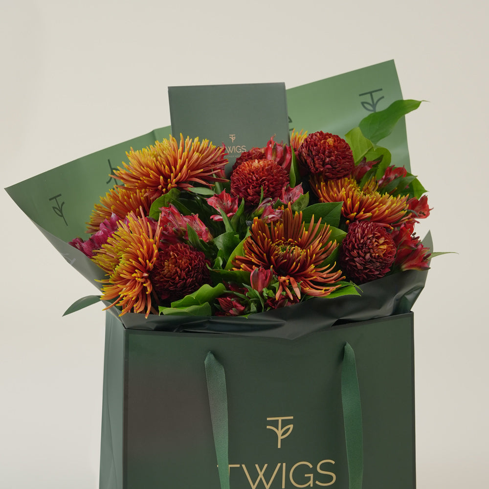 Ruby Eid flower bouquet with saffina chrysanthemums in TWIGS signature gift bag Dubai