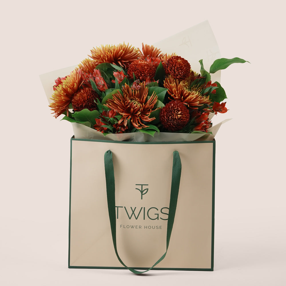 Ruby Eid flower bouquet with saffina chrysanthemums in TWIGS signature gift bag Dubai