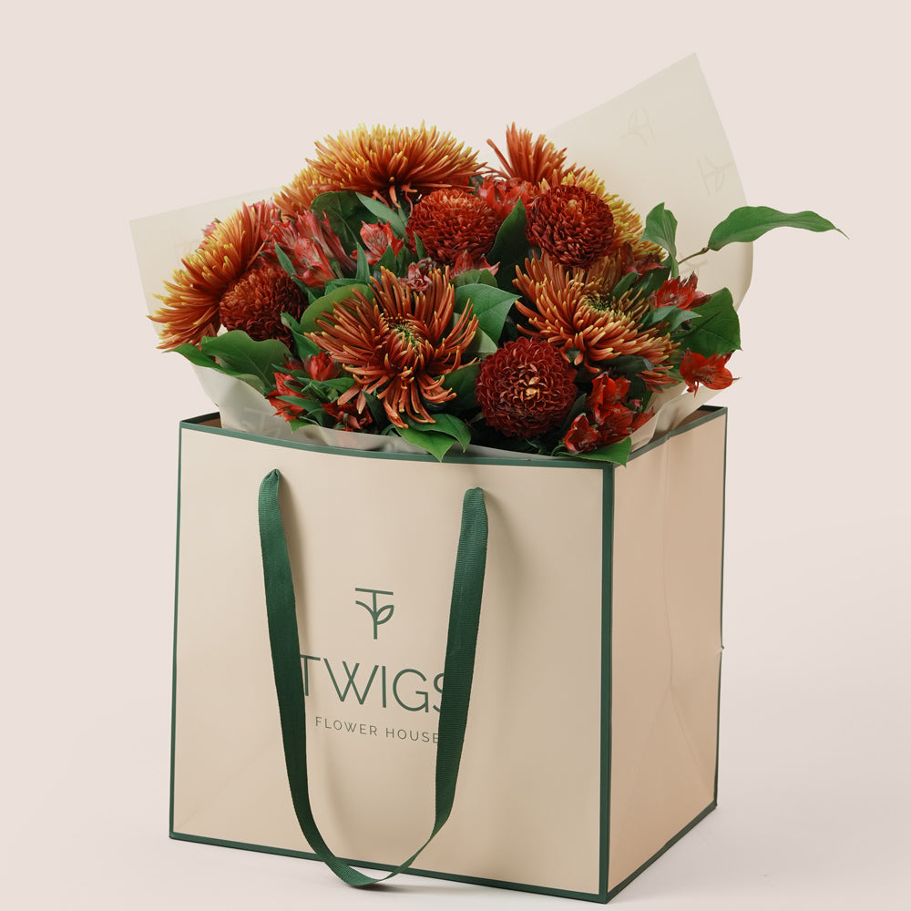 Ruby Eid flower bouquet with saffina chrysanthemums in TWIGS signature gift bag Dubai