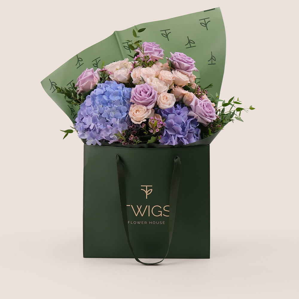 Purple Hydrangea & Rose Hand Bouquet – Soft Elegance in a Chic Flower Gift Bag