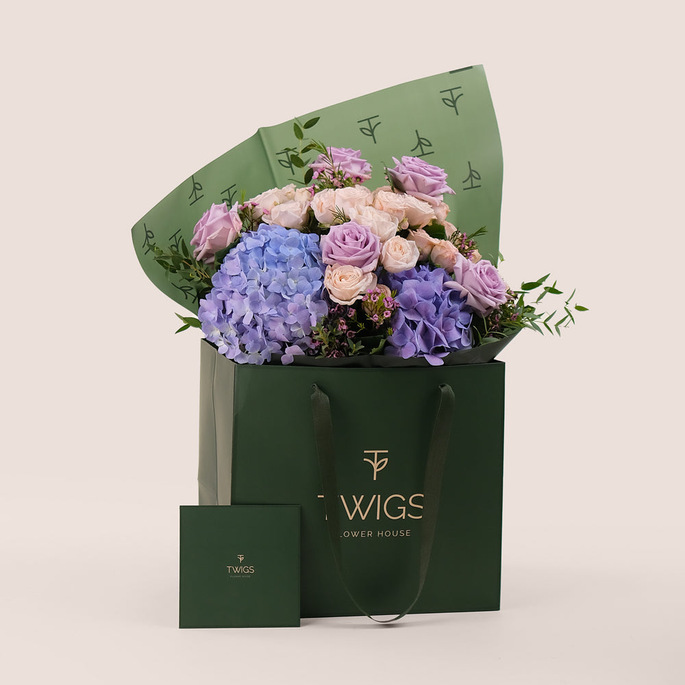 Purple Hydrangea & Rose Hand Bouquet – Soft Elegance in a Chic Flower Gift Bag