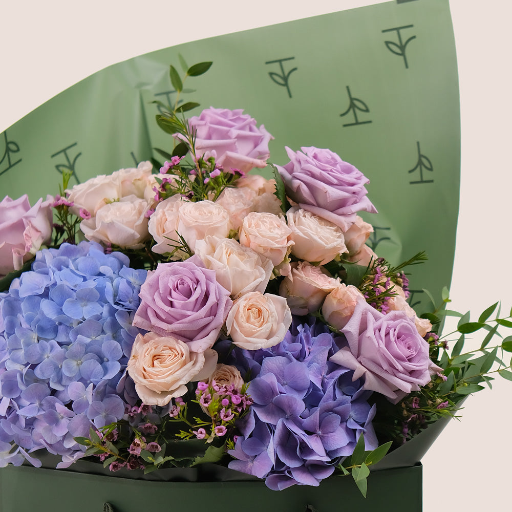 Purple Hydrangea & Rose Hand Bouquet – Soft Elegance in a Chic Flower Gift Bag