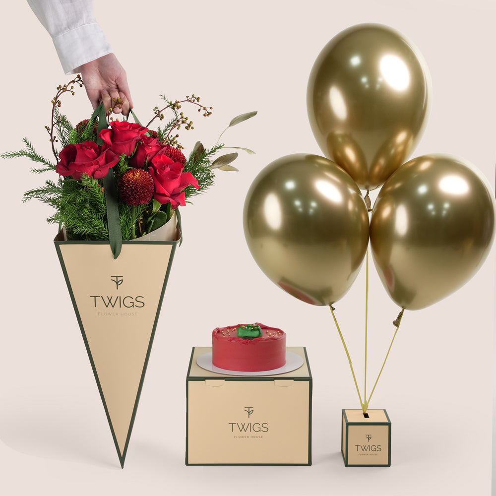 TWIGS Flower House Christmas gift bundle including red flower bunch, red holiday cake, and metallic gold balloons