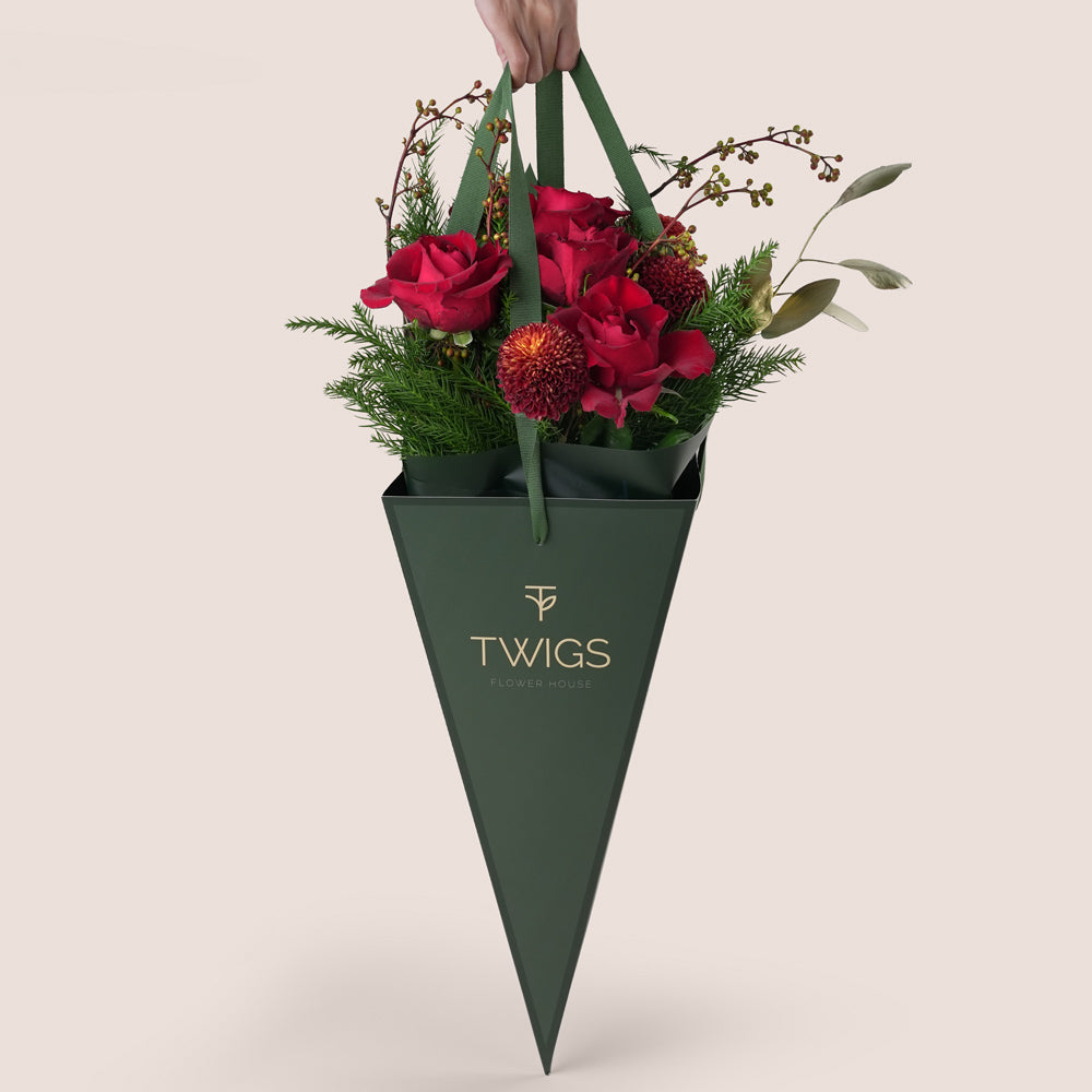 Christmas bouquet with red roses and pine leaves Twigs UAE