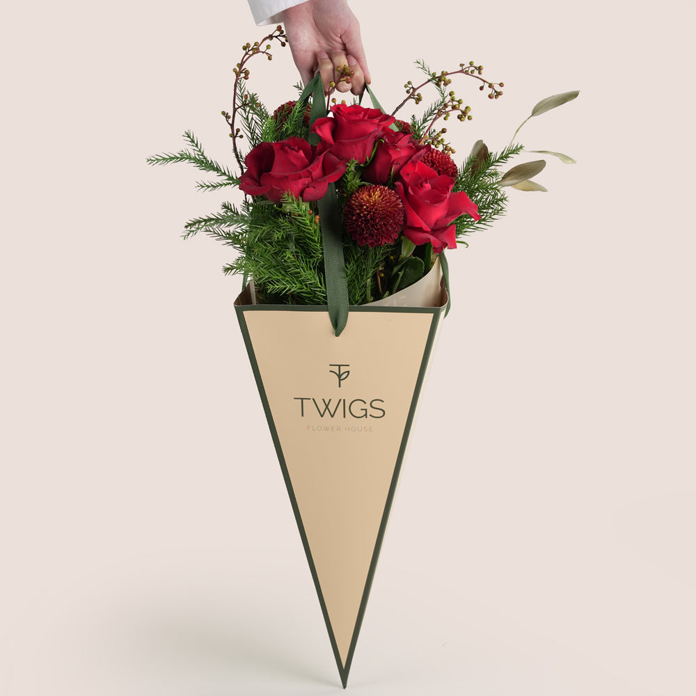 Christmas bouquet with red roses and pine leaves Twigs UAE