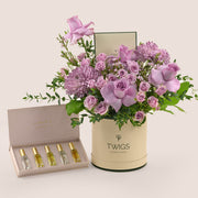 Emirati Women's Day lavender roses and purple chrysanthemums Deluxe round box bundled with Massarah Light of Sakina perfume oil discovery set