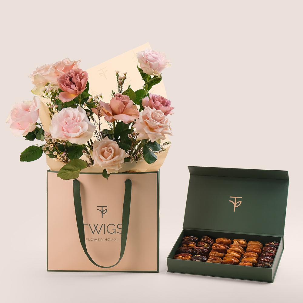 Elegant bouquet of café latte, mondial and quicksand roses in TWIGS beige gift bag paired with premium assorted stuffed dates gift box – luxury flower and dates gift Dubai.