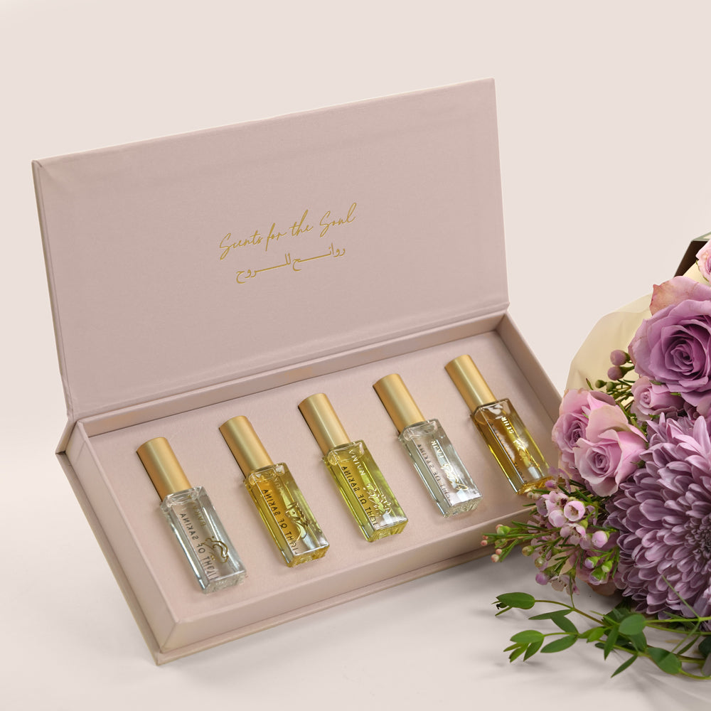 Emirati Women's Day lavender roses and purple chrysanthemums bunch bag bundled with Light of Sakina Massarah perfume oil discovery set