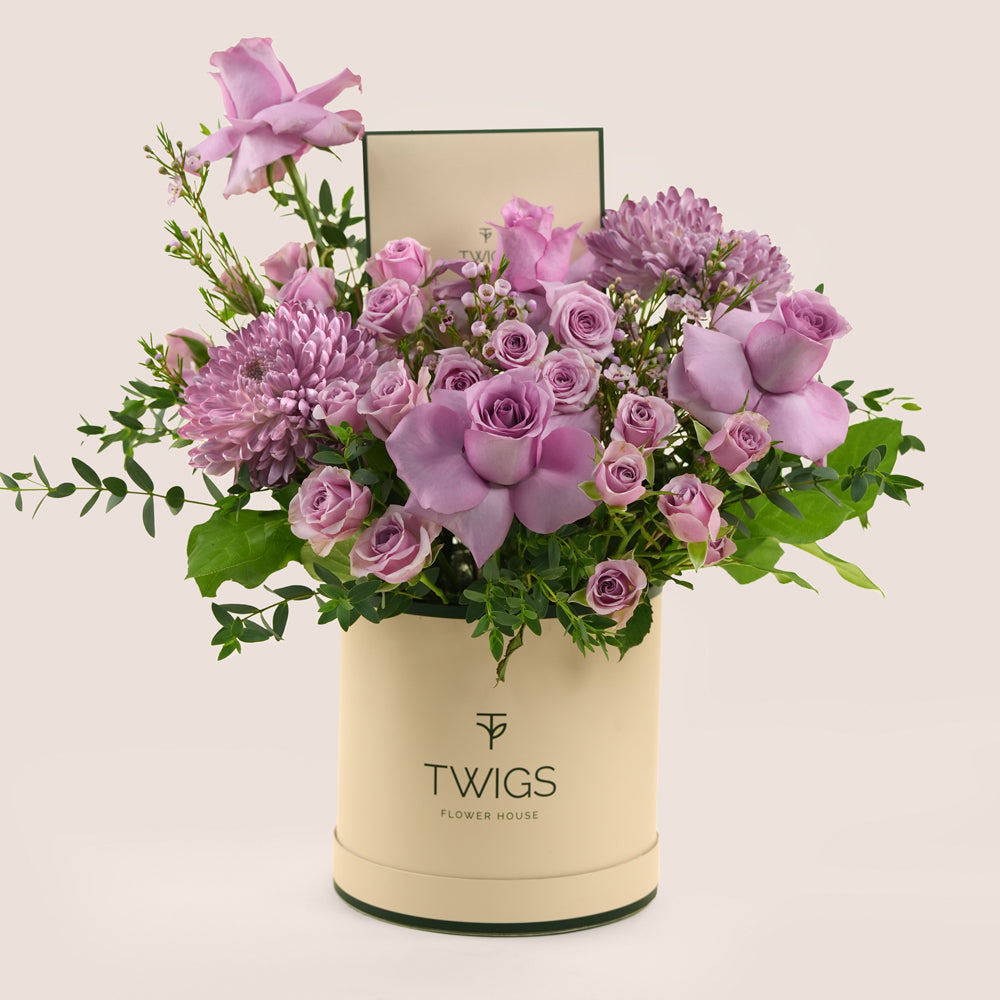 Emirati Women's Day lavender roses and purple chrysanthemums arranged in a TWIGS Deluxe round box, Green and Beige options